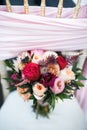 Beautiful wedding bouquet on the white chair Royalty Free Stock Photo