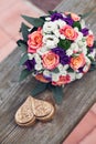 Beautiful wedding bouquet of white orange and pink roses with a decorative brown box for rings Royalty Free Stock Photo