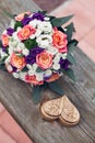 Beautiful wedding bouquet of white orange and pink roses with a decorative brown box for rings Royalty Free Stock Photo