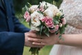 Beautiful wedding bouquet of white and pink peony in bride& x27;s. Royalty Free Stock Photo