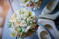 Beautiful wedding bouquet and white shoes Royalty Free Stock Photo