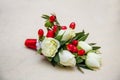 Beautiful wedding boutonniere of varios flowers on white wooden background Royalty Free Stock Photo
