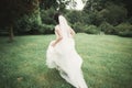 Beautiful wedding bride running in the garden Royalty Free Stock Photo