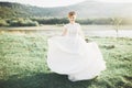 Beautiful wedding bride running in the garden Royalty Free Stock Photo