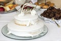 Beautiful wedding cake with cream With text Love on top white flowers roses Royalty Free Stock Photo