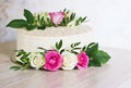 Beautiful Wedding cake with flowers on marble table and white background Royalty Free Stock Photo