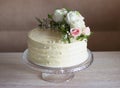 Beautiful Wedding cake with flowers on marble table and white background Royalty Free Stock Photo