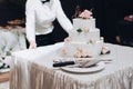 Beautiful wedding cake with flowers on table Royalty Free Stock Photo