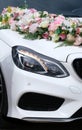 Beautiful wedding car. Front of the luxury car decorated flowers. Royalty Free Stock Photo