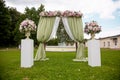 Beautiful wedding ceremony outdoors. Decorated chairs stand on the grass. rustic style. Royalty Free Stock Photo