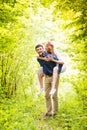 Beautiful wedding couple outside in green forest. Royalty Free Stock Photo