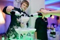 Beautiful wedding couple is pouring champagne indoors Royalty Free Stock Photo