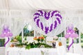 Beautiful wedding decorations. Heart of white and purple balloons on a celebratory table Royalty Free Stock Photo