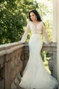 Beautiful wedding dresses in boutique. Happy bride before wedding. woman is preparing for wedding. Wonderful bridal gown