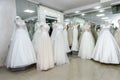 Beautiful wedding dresses on a mannequin in bridal shop