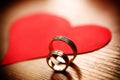 Beautiful wedding golden rings with a heart