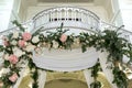 Beautiful wedding huppah decorated with fresh fresh flowers from hydrangea and eucalyptus sheets in a large beautiful wedding hall