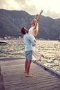 Beautiful wedding photo on mountain lake.couple in love, bride in white dress enjoys the embrace of her man Royalty Free Stock Photo