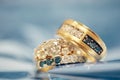 Beautiful wedding rings rose gold white and blue diamonds Royalty Free Stock Photo