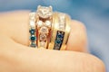 Beautiful wedding rings rose gold white and blue diamonds Royalty Free Stock Photo