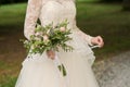 Beautiful wedding rustic bouquet in bride's hand Royalty Free Stock Photo