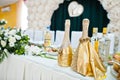 Beautiful wedding set decoration in the restaurant. Bottles of champagne in table of newlyweds Royalty Free Stock Photo