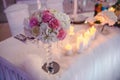 Beautiful wedding table decorations with unique floral compositions and candles Royalty Free Stock Photo