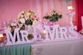 Beautiful wedding table with Mr. & Mrs sign Royalty Free Stock Photo