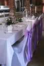 Beautiful wedding table set with purple decorations and lavender Royalty Free Stock Photo