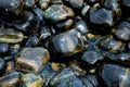 Beautiful wet black stones at Koh Hin Ngam in summer time concept travel, holiday and vacation. Tropical paradise beach nature la Royalty Free Stock Photo