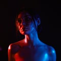 Beautiful wet Girl in the dark, colorful portrait