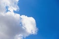 Beautiful white big soft fluffy cloud on a clear blue sky background Royalty Free Stock Photo