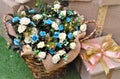 Beautiful white and blue artificial flower basket with Christmas gifts