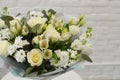 Beautiful white bouquet of flowers in stylish paper. Royalty Free Stock Photo