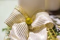 A beautiful white bow with gold details. Detail of a great Christmas bow.