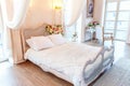 Beautiful white bright clean interior bedroom in luxurious baroque style