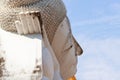 Beautiful white buddha face sleeping at peace with blue sky and