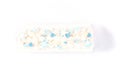 Beautiful white cake roll in front of a white background. The cake has snowflake-shaped confectionery decorations Royalty Free Stock Photo