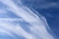 Beautiful white cirrus cloud formations on a deep blue sky Royalty Free Stock Photo