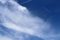 Beautiful white cirrus cloud formations on a deep blue sky Royalty Free Stock Photo