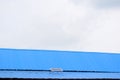 Beautiful white cloud on the sky through the roof of a tin shed building