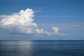 beautiful white clouds on blue sky over calm sea Royalty Free Stock Photo