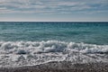 Beautiful white clouds in blue sky over texciting sea, ocean with sunlight reflection. Sea harmony of white scallops of Royalty Free Stock Photo