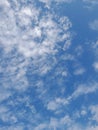 The white clouds on the blue sky are perfect for the background. Skyscape on Lombok Island, Indonesia Royalty Free Stock Photo