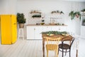beautiful white cosy modern kitchen interior,kitchenware, home style, with yellow fridge Royalty Free Stock Photo