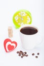 Beautiful white cup, coffee, hearts with an alarm clock on a white background