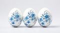 Beautiful white easter eggs decorated with blue flowers. Delft blue eggs