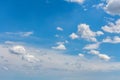 White fluffy clouds against a blue sky