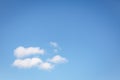 Beautiful white fluffy clouds on a clear blue sky background. Copy space Royalty Free Stock Photo