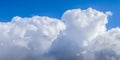 Beautiful white fluffy clouds in a deep blue summer sky Royalty Free Stock Photo